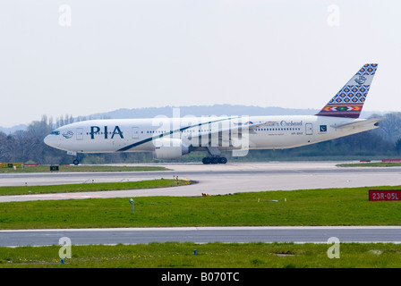 Pakistan Internation Airlines PIA Boeing 777 [777-240 ER] Taxiing After Landing at Manchester Ringway Airport England UK Stock Photo