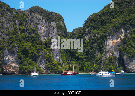 Tropical island cliffs with trees rise above waters of Andaman Sea. Krabi, Thailand Stock Photo