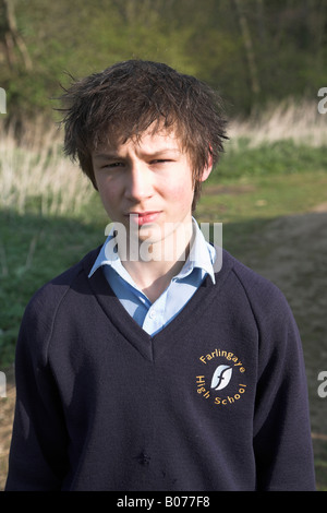 Teenage boy in navy blue school uniform Stock Photo