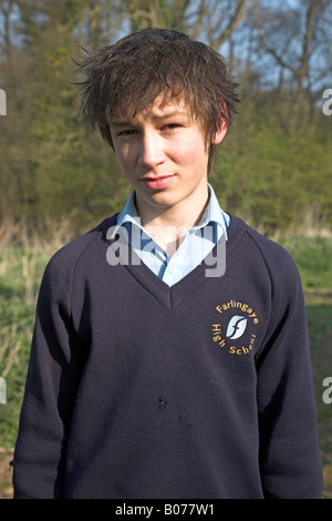 Teenage boy in navy blue school uniform Stock Photo