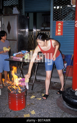 Woman Burning Spirit Money During Ghost Month Taiwan Stock Photo