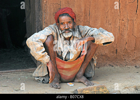Old man smoking  bidi, an Indian cigarette made of tobacco leaves or beedi leaves. Thakkar tribe Rural faces of India Stock Photo