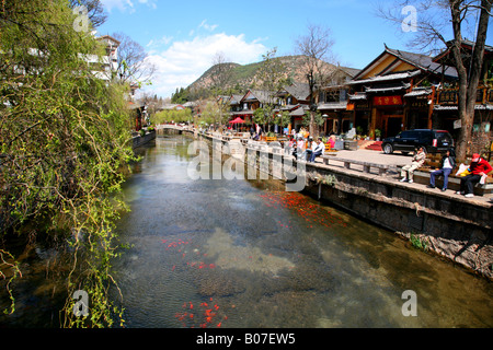 River running through center of Lijiang Old Town, in China’s Yunnan Province.. Stock Photo