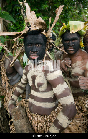 Vanuatu, Tanna Island Fetukai, Black Magic and Kava Test Tour-Villagers in Native Dress-warrior greetings MR# VAN 07 001 Stock Photo