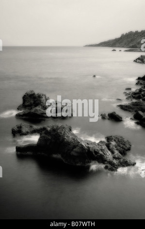 Black and white photograph ofthe coastline  Etna mountain in Sicily Stock Photo