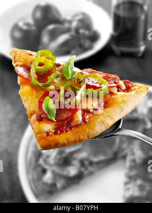 Pepperoni thin crust pizza with chilis ( American hot ) Stock Photo