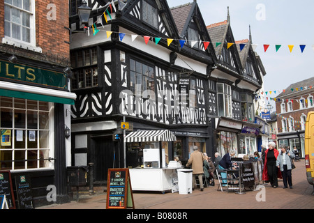 NANTWICH CHESHIRE April People sitting outside a cafe in the pedestrianised centre of this historic market town Stock Photo