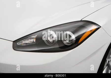 2008 Hyundai Tiburon GS in White - Headlight Stock Photo