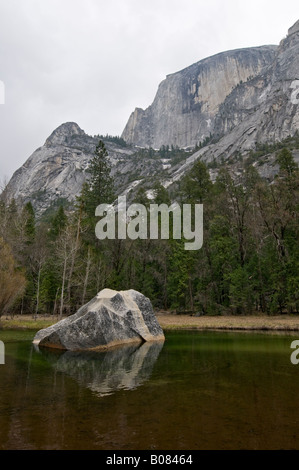 Yosemite National Park, California - April 22, 2008: Early spring view of Half Dome towering over Mirror Lake Stock Photo