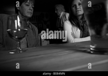 a portrait of three generations in one family drinking in a pub Stock Photo