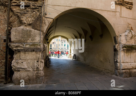arch to Piazza Anfiteatro Romano remains of a Roman amphitheatre in Lucca Tuscany Stock Photo