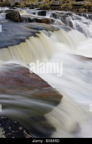 Fast flowing water over rocks at Tavy Cleave in Dartmoor National Park Devon England Stock Photo