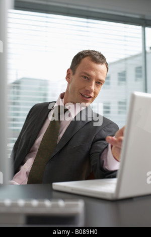Mature man looking at a laptop Stock Photo