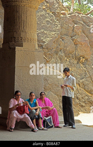 Visitors resting Elephanta Island Hindu temple caves  India Stock Photo