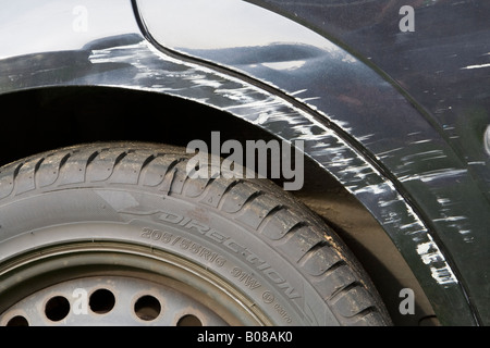 A ^damaged car wheel arch, UK. Stock Photo