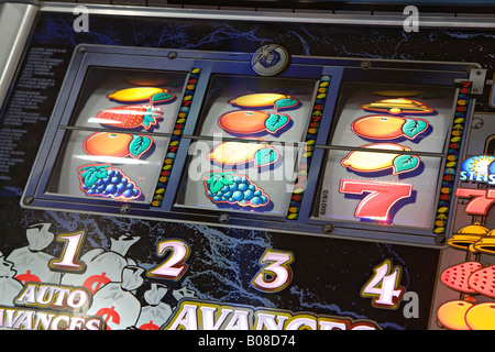 Slot machine showing losing line of fruit Stock Photo