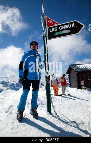 Young man at the top of the Chamossiere Ski-Lift in  Morzine Stock Photo