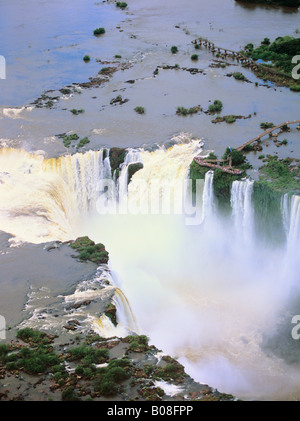 South America, Brazil, Argentina, Igwazu Falls. Igwacu Falls thunder into the Igwacu River below. South America, Brazil, Argentina, Igwazu Falls. Igwacu Falls thunder into the Igwacu River below.