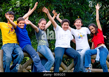 Kids waving at camera Stock Photo