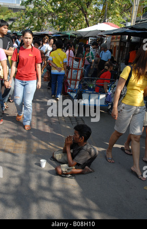 beggar at chatuchak weekend market, bangkok, thailand Stock Photo
