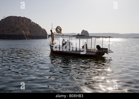 Boat heading out to the Temple of Philae, Island of Isis, Agiliki, Aswan, Egypt Stock Photo