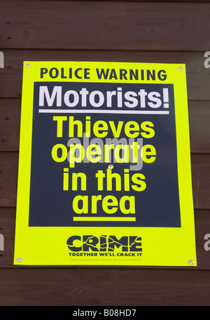 police sign warning of car thieves in the area Stock Photo