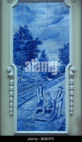Painted Azulejos tiles on Madeira depicting funicular railway and tourist toboggan Stock Photo