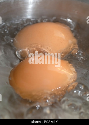 Eggs Boiling in Water Stock Photo