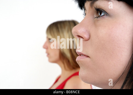 portrait of a black-haired and a fair-haired woman Stock Photo