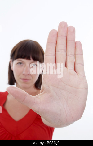 woman with sprawled out hand, symbolic for Stop Stock Photo - Alamy