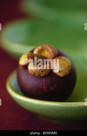 mangosteen garcinia mangostana fruit on a plate Stock Photo