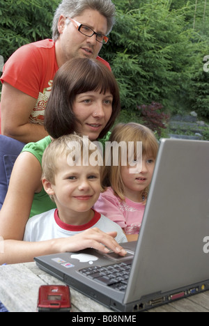 family using laptop Stock Photo