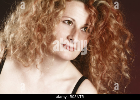 fair-haired woman with long curly hair Stock Photo