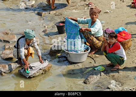 Women washing laundry in the Irrawaddy or Irawadi River, Myanmar (Burma), Southeast Asia Stock Photo