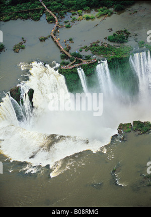 South America, Argentina, Brazil, Igwazu, Foz, Falls. Igwacu Falls thunder into the River Igwacu below. South America, Argentina, Brazil, Igwazu, Foz, Falls. Igwacu Falls thunder into the River Igwacu below.
