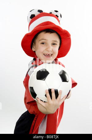 boy as Austrian soccer fan, with football and funny hat Stock Photo