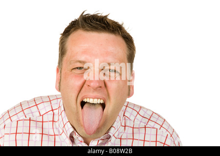 40-year-old man sticking out his tongue Stock Photo