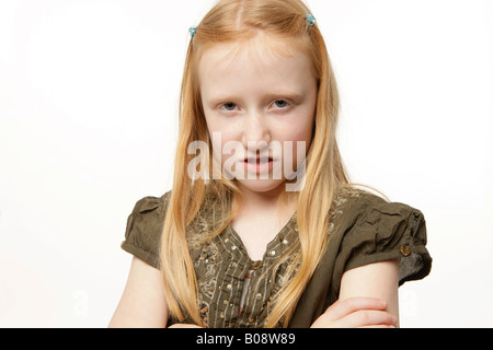 8-year-old redheaded girl, angry Stock Photo