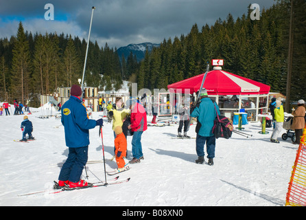 Skiers in front of a refreshment tent in the Jasna Ski Resort, Lower Tatras, Slovakia Stock Photo