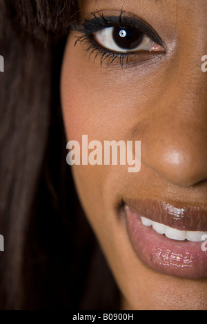 Close-up of a young dark-skinned woman's smiling face Stock Photo