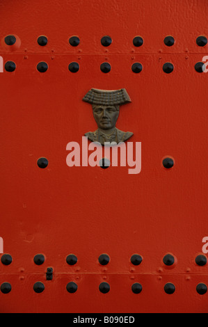 Head of a matador mounted on a red door, Real Maestranza de Sevilla bullring, Seville, Andalusia, Spain Stock Photo