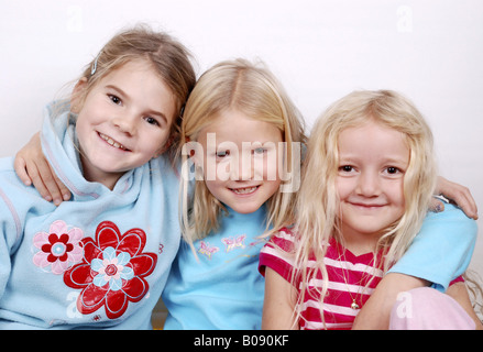 three girl friends, arm in arm Stock Photo