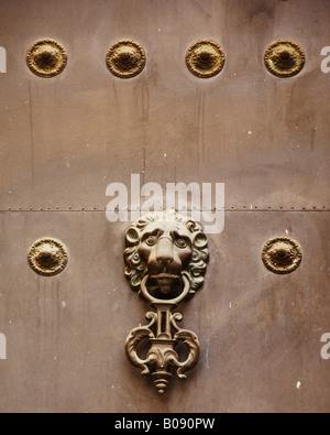 Lion head door knocker on an old door in Seville, Andalusia, Spain Stock Photo