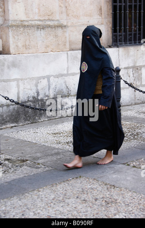 Penitent in traditional hood and robe in an Easter parade on Holy ...