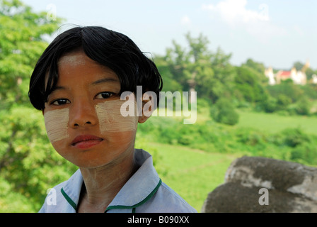 Girl, her face made up with tanaka, Mandalay, Myanmar (Burma), Southeast Asia Stock Photo