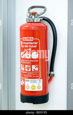 Fire extinguisher mounted on wall Stock Photo - Alamy