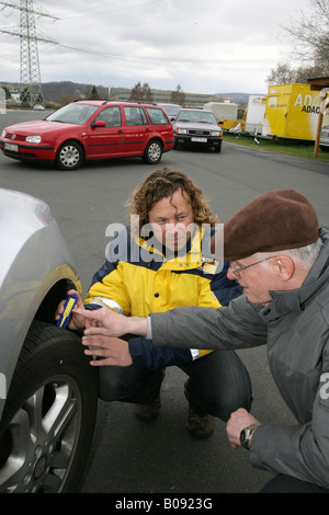 Dirk Mueller, ADAC (German automobile club) instructor explaining the importance of the correct tire tread depth and air pressu Stock Photo