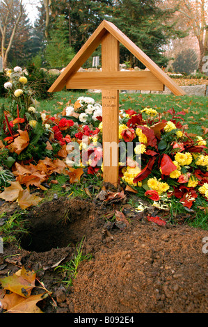 Recently dug-up urn grave at a cemetery in Karlsruhe, Germany Stock Photo