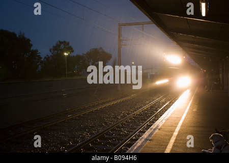 The 6.17am commuter train for Wellington on a rainy morning at Palmerston North station New Zealand Stock Photo