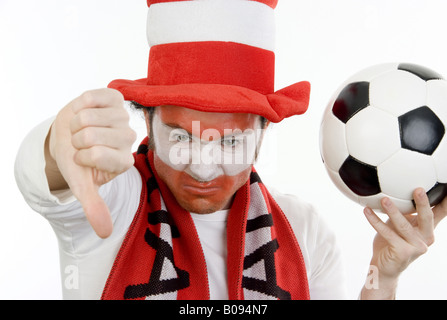 disappointed Austrian soccer fan makes thumb down Stock Photo